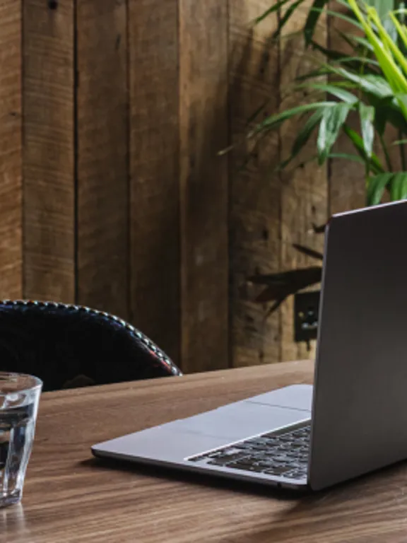 Laptop on table in the timberyard at The Dean Docklands