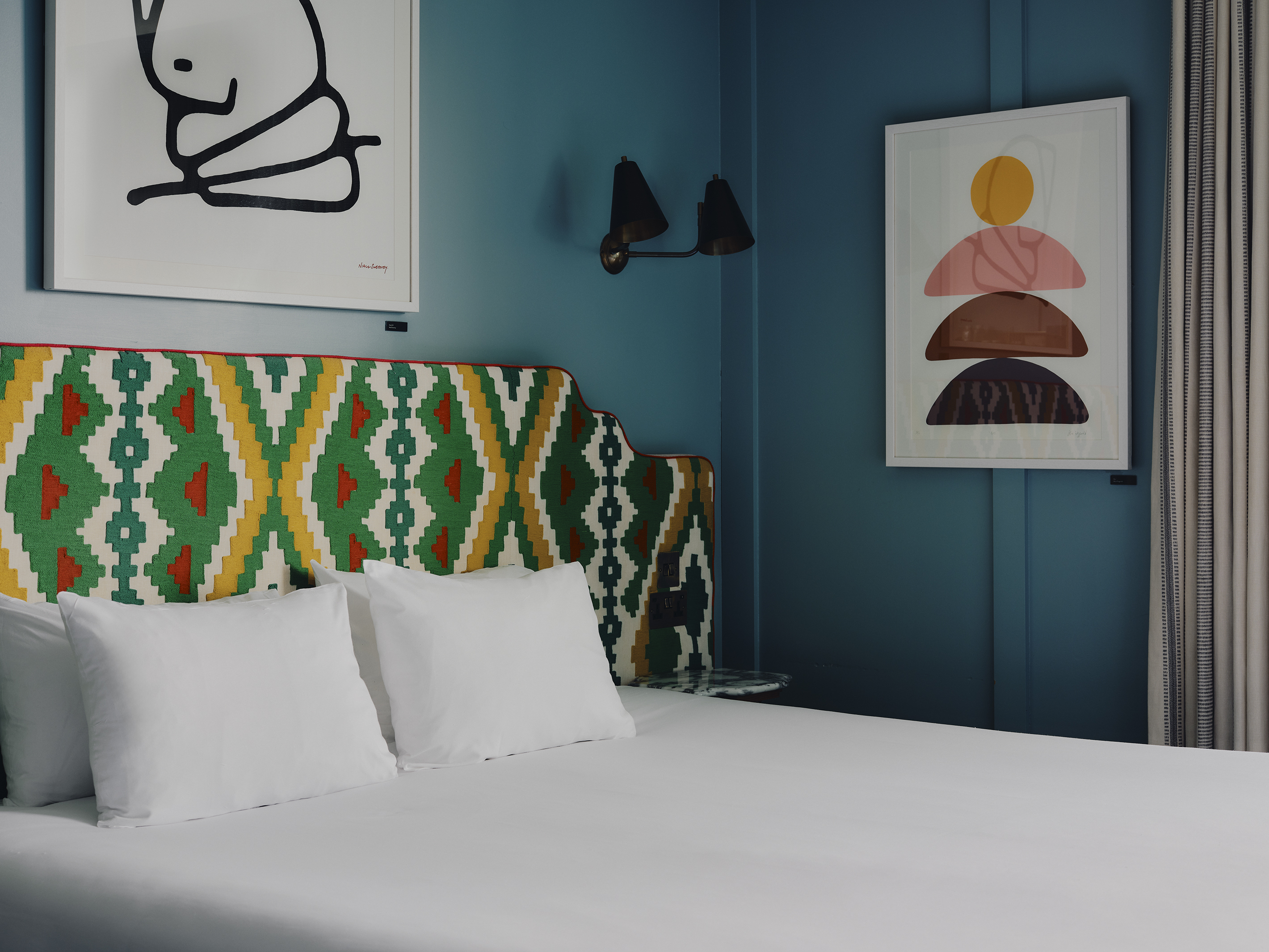 Close up of king bed in large room