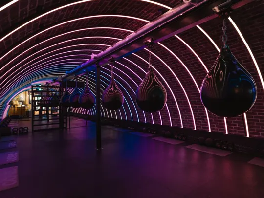 POWER GYM Box tunnel in the Dean Galway with boxing bags and neon lights adorning the tunnel