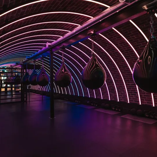 POWER GYM Box tunnel in the Dean Galway with boxing bags and neon lights adorning the tunnel