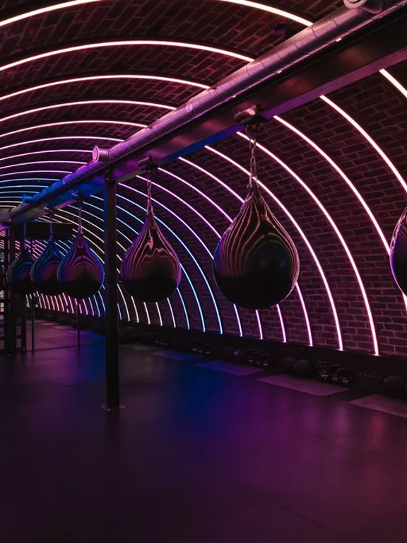 POWER GYM Box tunnel in the Dean Galway with boxing bags and neon lights adorning the tunnel