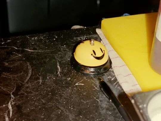 Smiley desk bell at the Dean Hotels