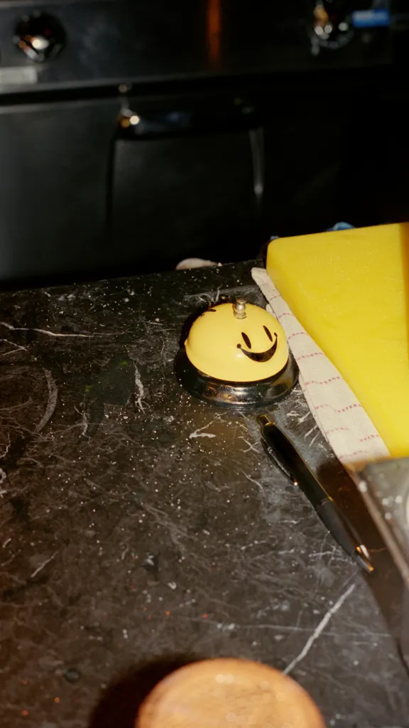 Smiley desk bell at the Dean Hotels