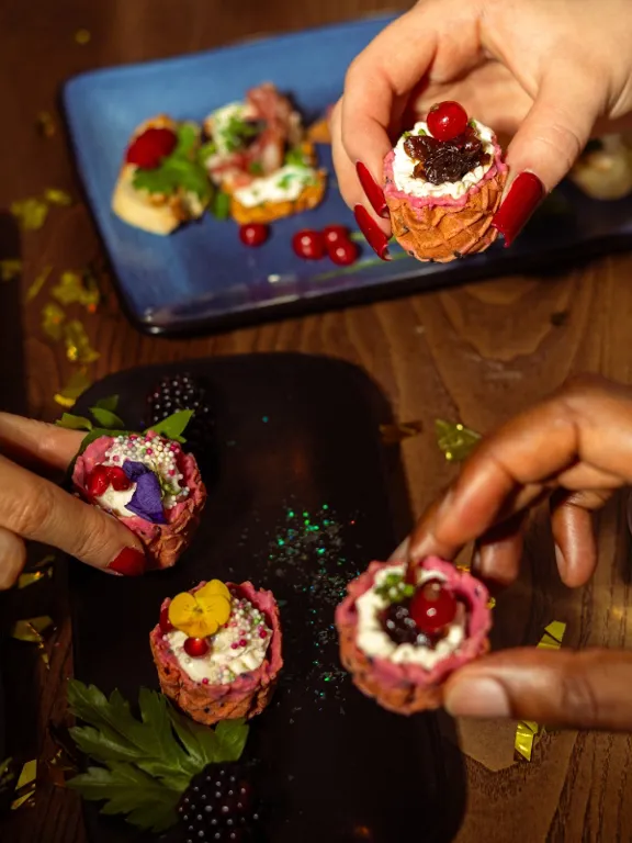 Friends enjoying canapes in The Dean hotels for Christmas