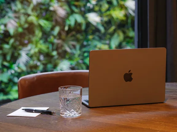 Laptop on table in the timberyard at The Dean Docklands