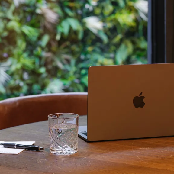 Laptop on table in the timberyard at The Dean Docklands