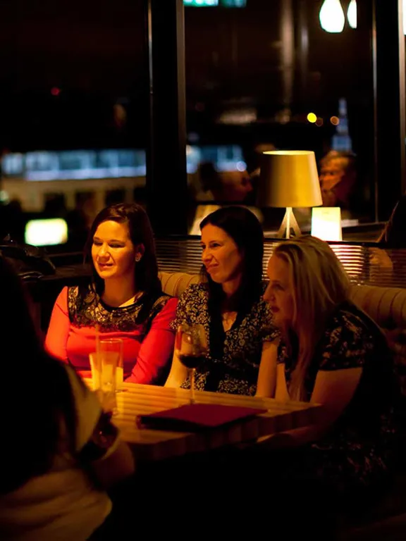Girls enjoying dinner at Sophies Rooftop Restaurant at The Dean Cork