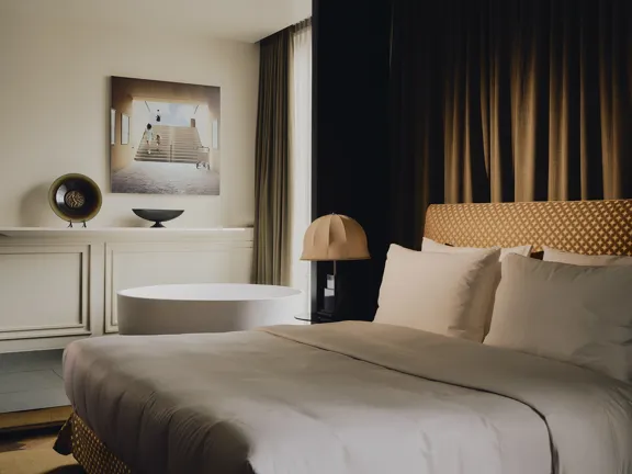 Bed and freestanding Tub in The Premium Suites at The Dean Munich