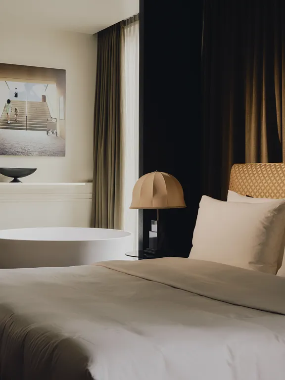 Bed and freestanding Tub in The Premium Suites at The Dean Munich