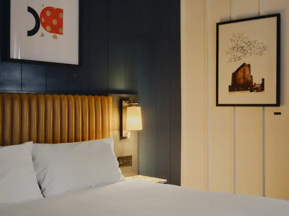 Side of Bed in Copper Suite with light on