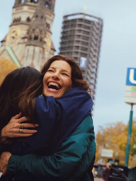 Friends Hugging outside UBahn stop near the Dean Berlin