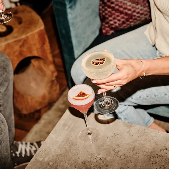 Couple enjoying cocktails in The Dean Docklands Lobby