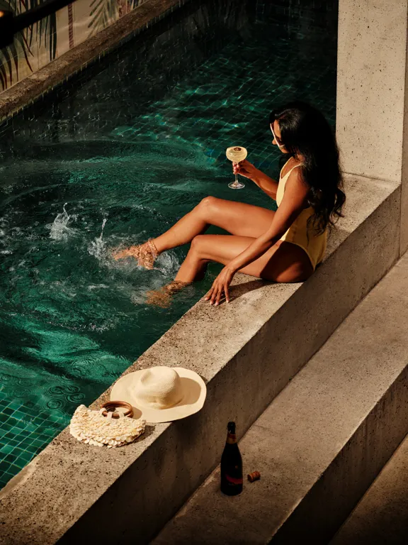 Woman by the pool in POWER Gym at The Dean Docklands