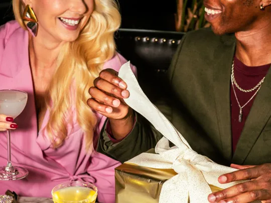 Friends opening gifts at the Dean Hotels during Christmas