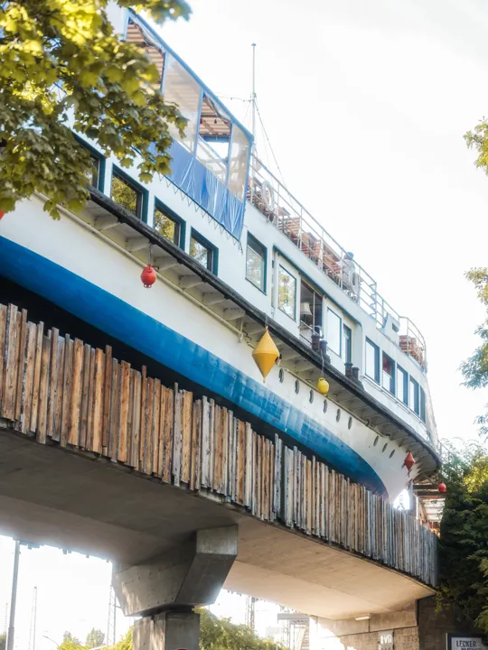 Alte Utting Exterior - Offbeat bar on a former steamer ship featuring pizzas & crepes, plus vegan & West African fare.